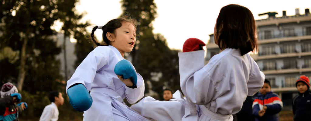 children practicing martial arts