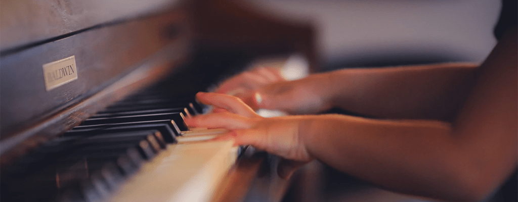 child playing the piano during lockdown